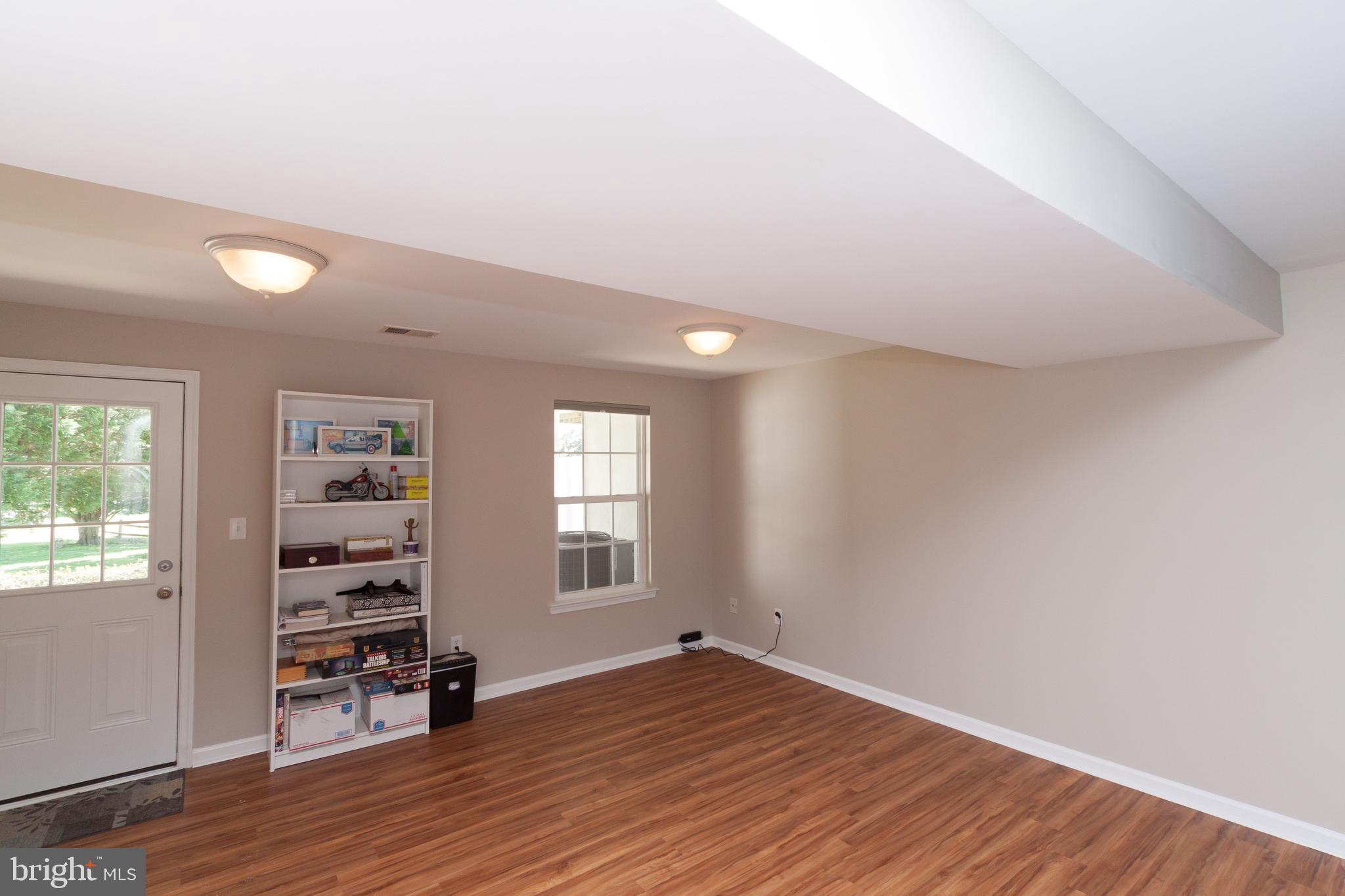 23575 Devonshire Road, Unit 90 Millsboro, DE 19966 - Photo 3 of 16 First floor Flex room with half bath and laundry