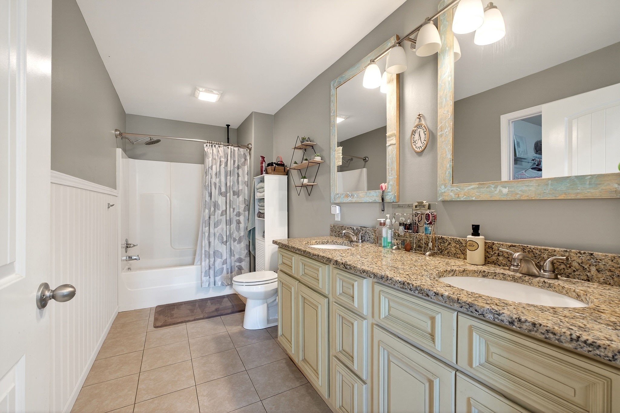311 Valley Point Baxter, TN 38544 - Photo 33 of 37 a spacious bathroom with a granite countertop sink a toilet a mirror a vanity and shower