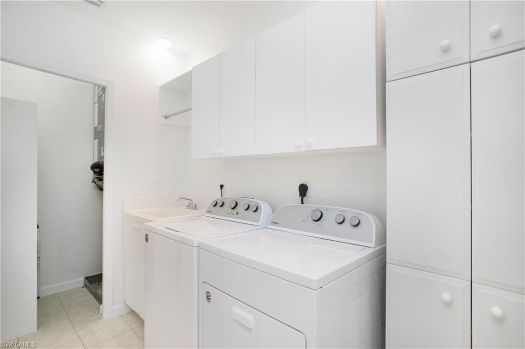 14560 Red Fox Run, Unit 515 Naples, FL 34110 - Photo 20 of 33 a utility room with dryer and washer