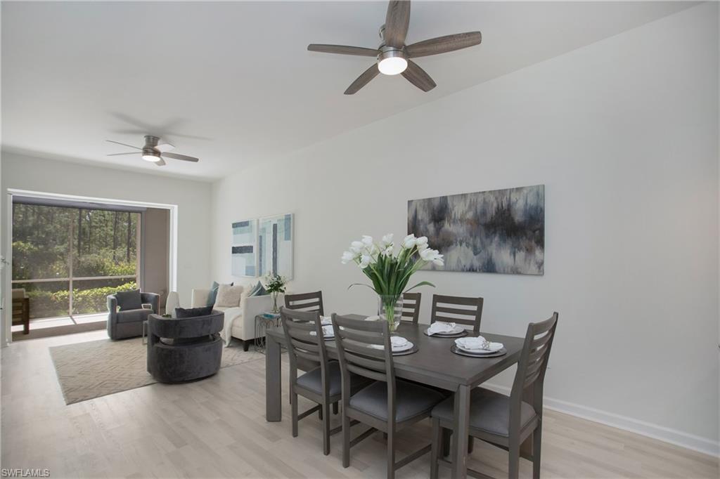 14560 Red Fox Run, Unit 515 Naples, FL 34110 - Photo 2 of 33 a view of a dining room with furniture window and outside view