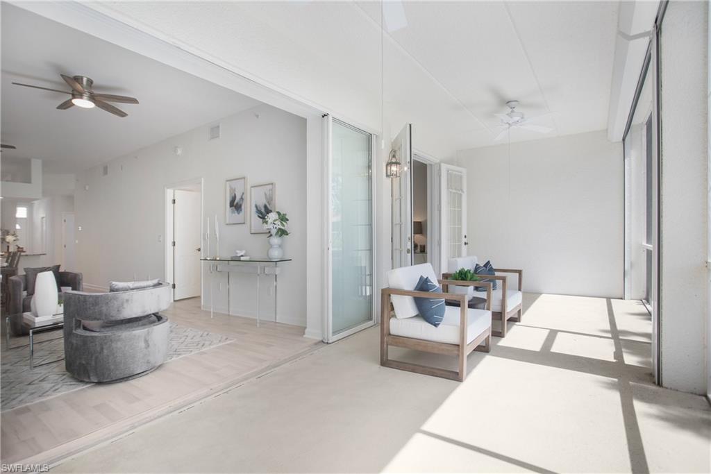 14560 Red Fox Run, Unit 515 Naples, FL 34110 - Photo 21 of 33 a living room with furniture and white walls