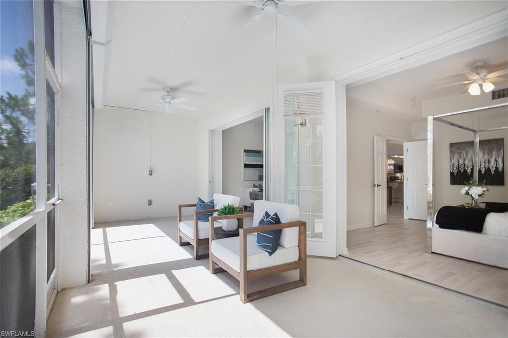 14560 Red Fox Run, Unit 515 Naples, FL 34110 - Photo 22 of 33 a living room with furniture and a table