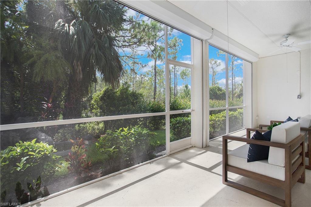 14560 Red Fox Run, Unit 515 Naples, FL 34110 - Photo 23 of 33 a living room filled with furniture and a potted plant
