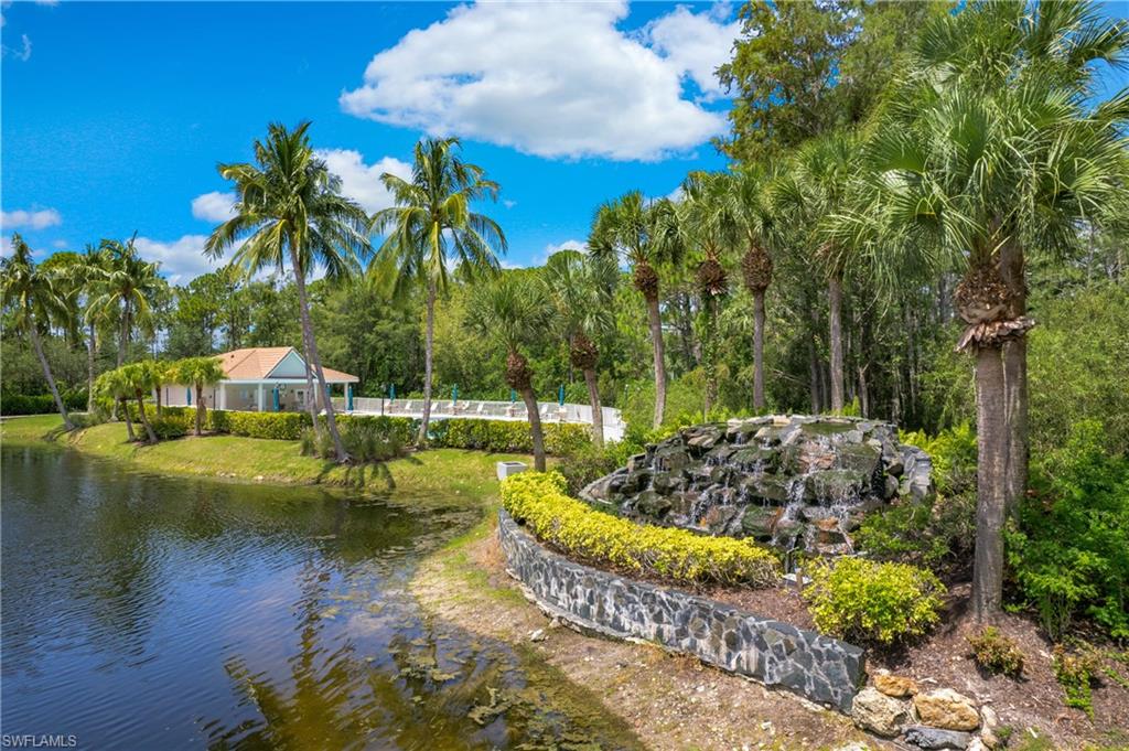 14560 Red Fox Run, Unit 515 Naples, FL 34110 - Photo 25 of 33 a view of a lake with a house in background