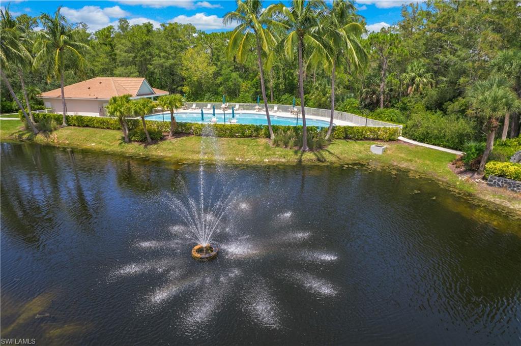 14560 Red Fox Run, Unit 515 Naples, FL 34110 - Photo 26 of 33 a view of swimming pool with a yard