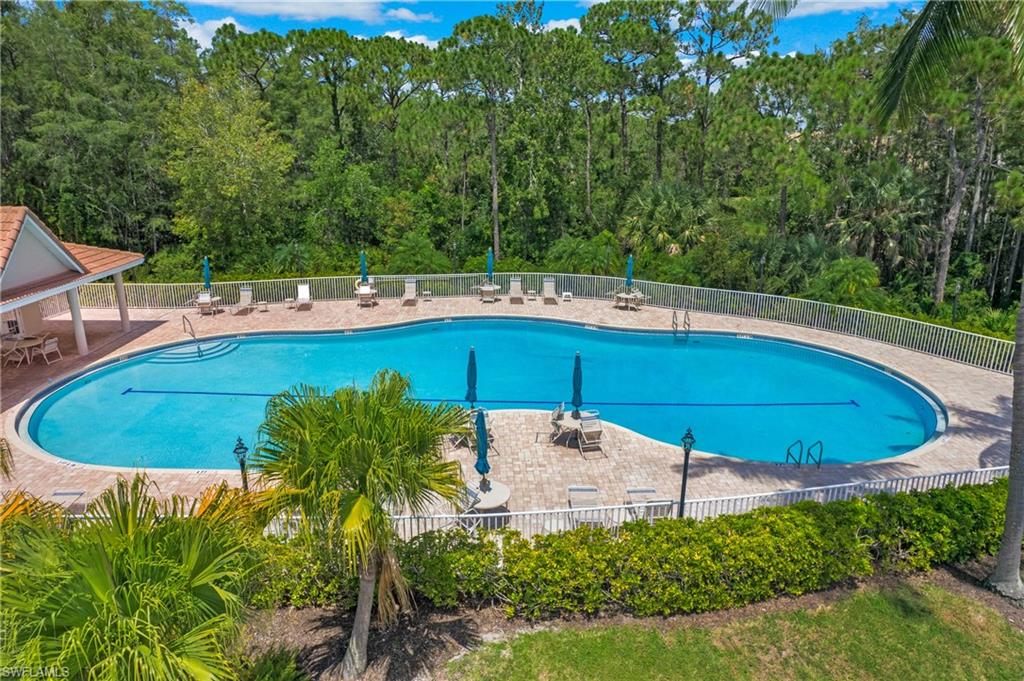 14560 Red Fox Run, Unit 515 Naples, FL 34110 - Photo 27 of 33 a view of a swimming pool with a patio