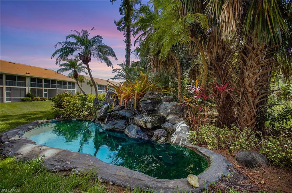 14560 Red Fox Run, Unit 515 Naples, FL 34110 - Photo 28 of 33 a view of a backyard with plants