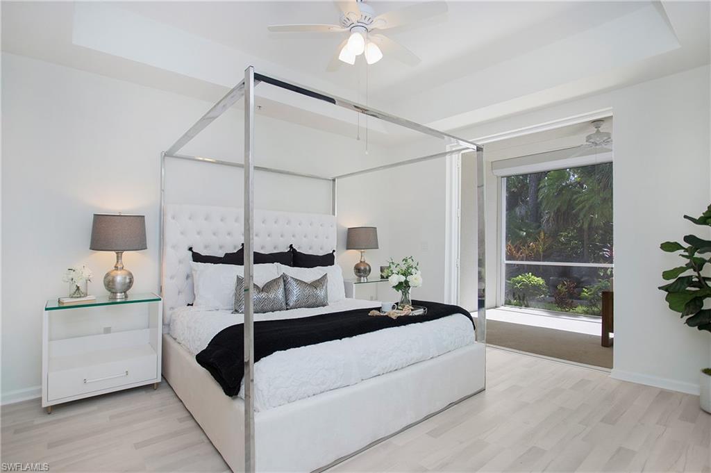 14560 Red Fox Run, Unit 515 Naples, FL 34110 - Photo 4 of 33 a bedroom with a large bed and a window
