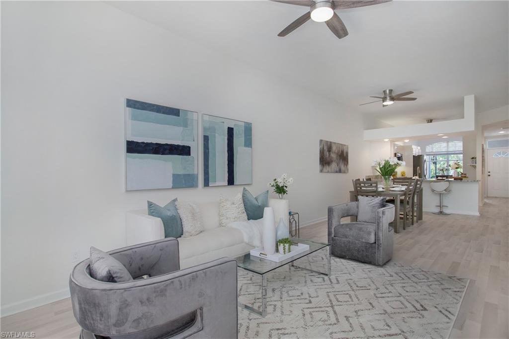 14560 Red Fox Run, Unit 515 Naples, FL 34110 - Photo 6 of 33 a living room with furniture and a table