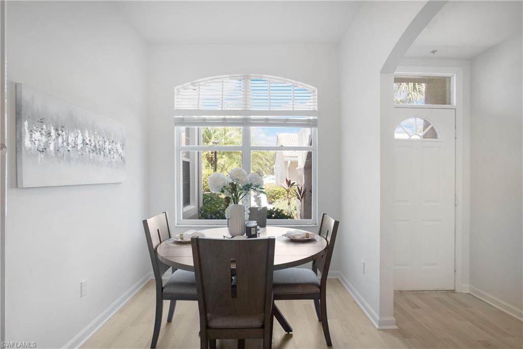 14560 Red Fox Run, Unit 515 Naples, FL 34110 - Photo 10 of 33 a view of a dining room with furniture window and outside view
