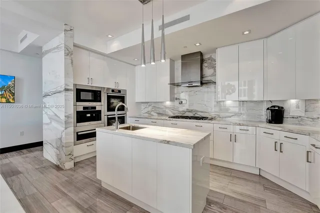 a spacious bathroom with a double vanity sink toilet mirror and bathtub