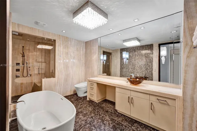 a bathroom with a sink shower and a mirror