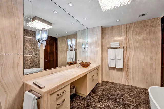 a bedroom with two beds and a flat screen tv