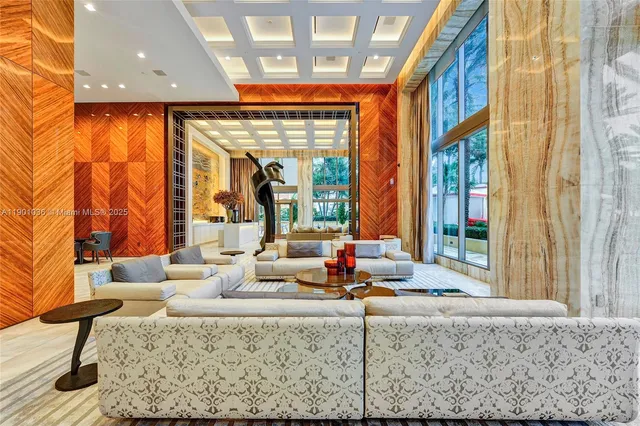 a view of a hallway with entryway wooden floor and front door