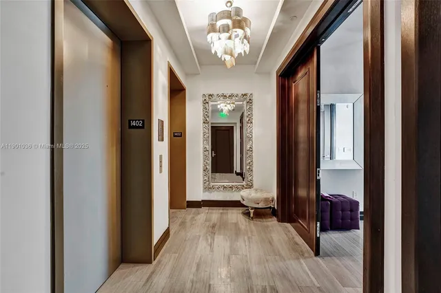 a large bedroom with a large bed and a flat tv screen