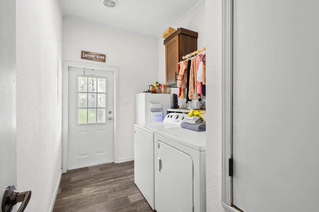 a room that has a bed and a dresser in it