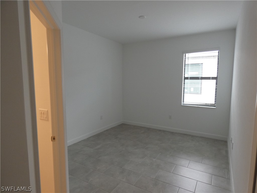 11379 Canopy Loop Fort Myers, FL 33913 - Photo 15 of 24 an empty room with a window