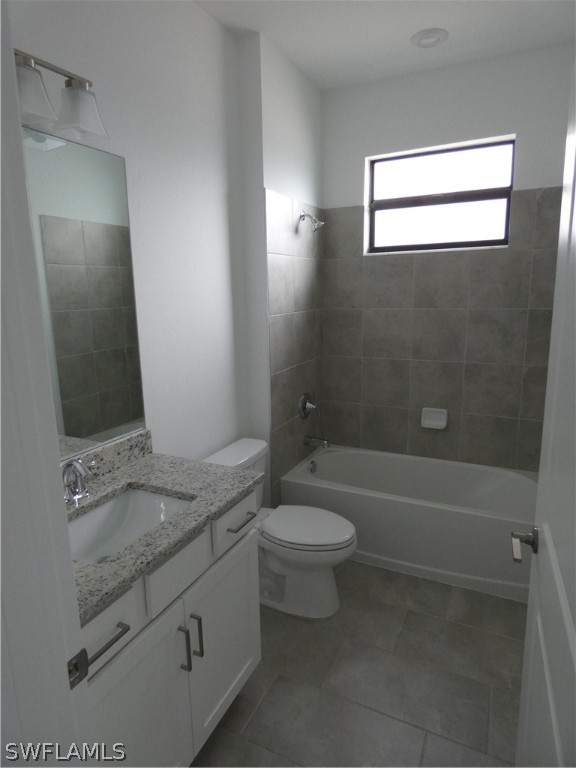 11379 Canopy Loop Fort Myers, FL 33913 - Photo 16 of 24 a bathroom with a granite countertop sink a toilet and bathtub