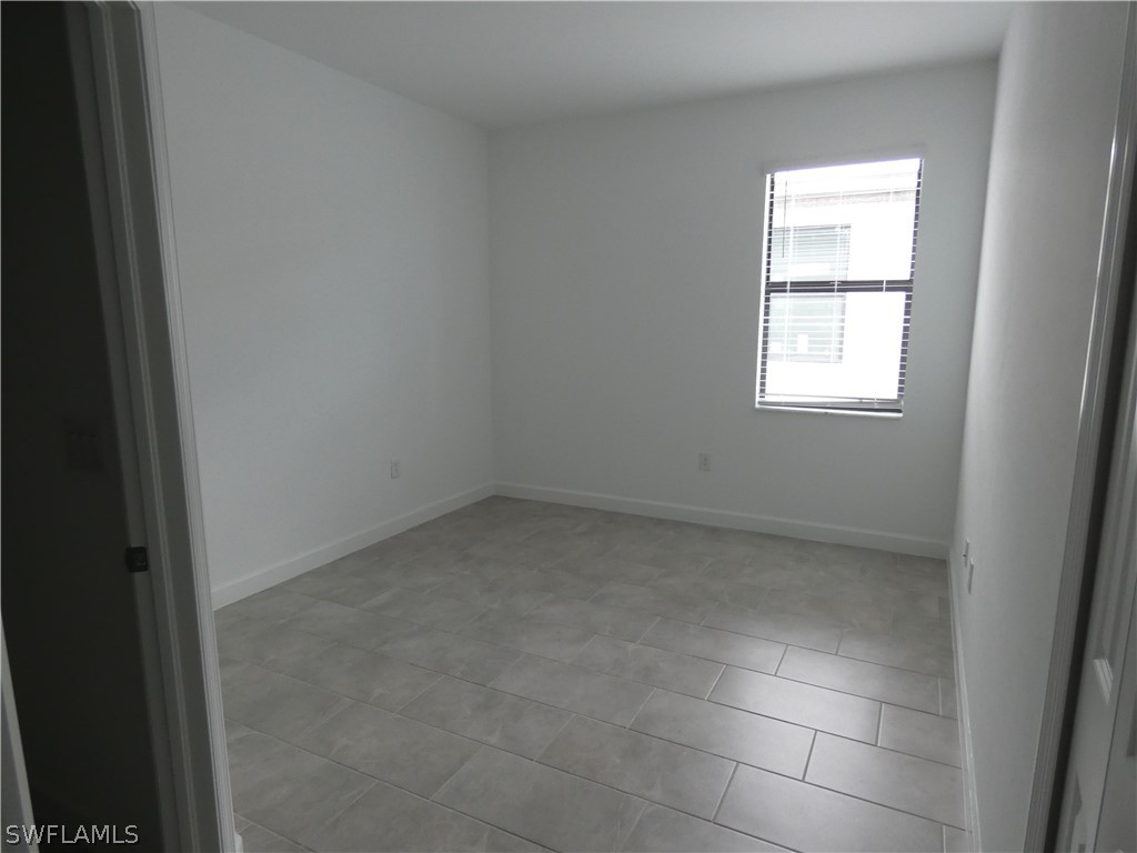 11379 Canopy Loop Fort Myers, FL 33913 - Photo 19 of 24 an empty room with a window