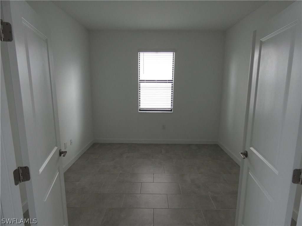 11379 Canopy Loop Fort Myers, FL 33913 - Photo 20 of 24 an empty room with a window