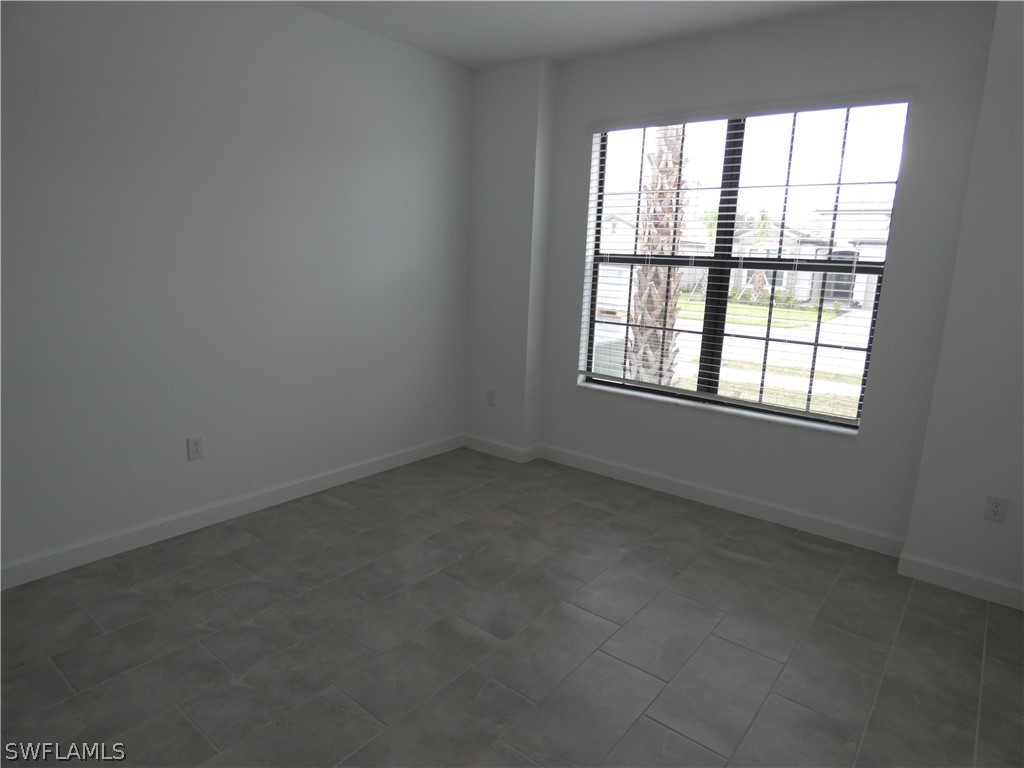 11379 Canopy Loop Fort Myers, FL 33913 - Photo 21 of 24 an empty room with a window