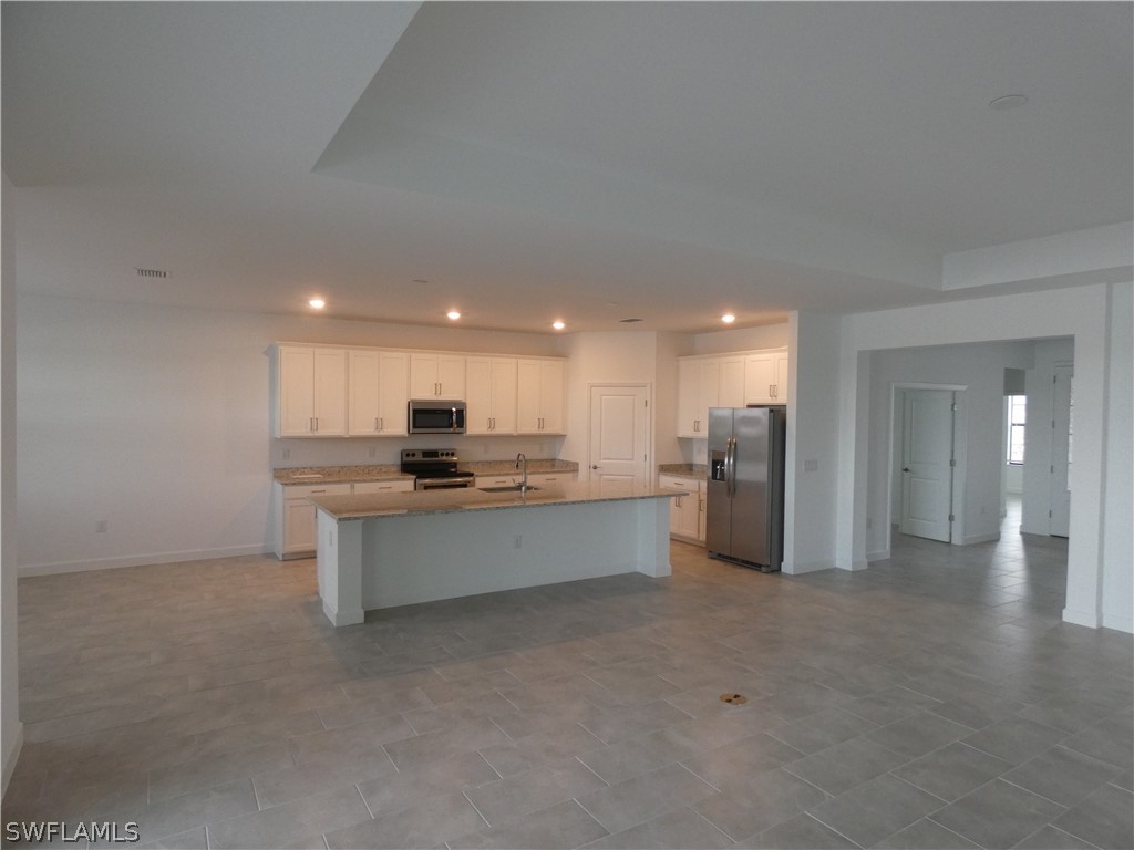 11379 Canopy Loop Fort Myers, FL 33913 - Photo 5 of 24 a large bathroom with a sink a mirror and a shower