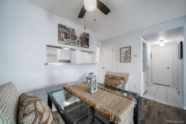 a kitchen with granite countertop white cabinets and a sink