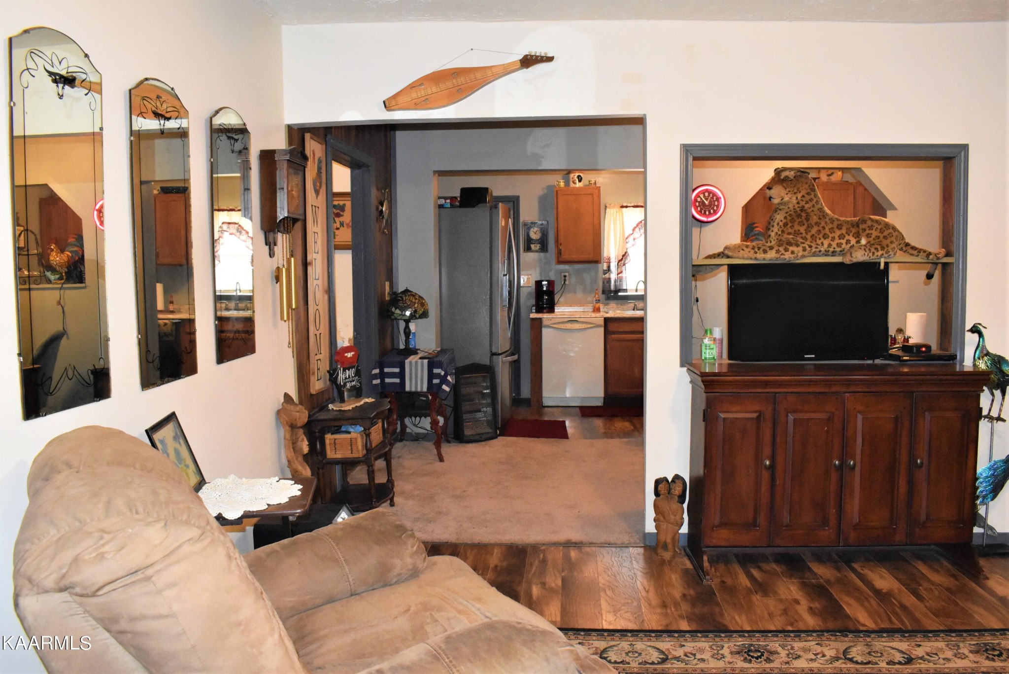 419 Stone Loop Crossville, TN 38571 - Photo 11 of 46 a living room with furniture a flat screen tv and a fireplace