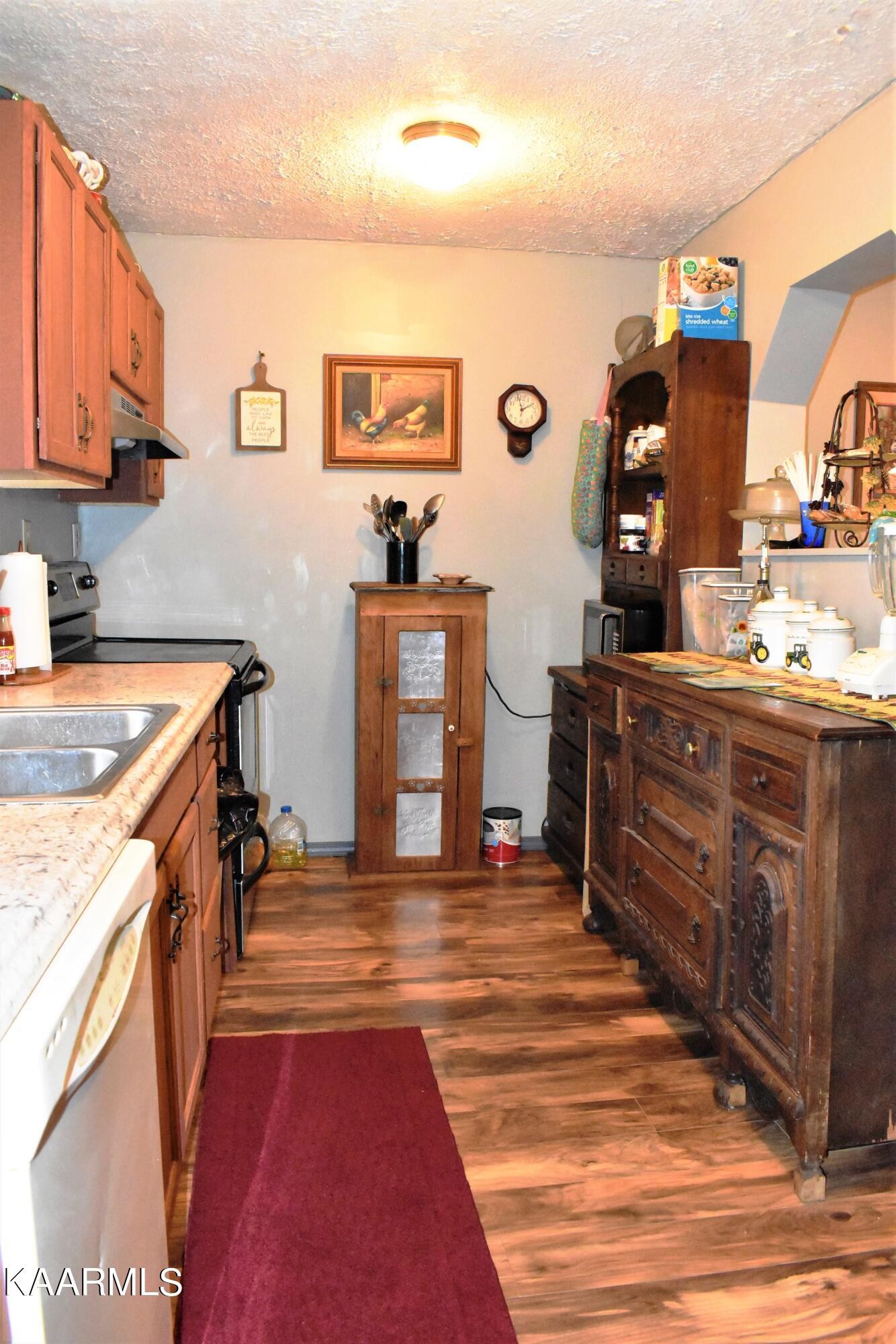 419 Stone Loop Crossville, TN 38571 - Photo 14 of 46 a kitchen with stainless steel appliances granite countertop a sink and cabinets