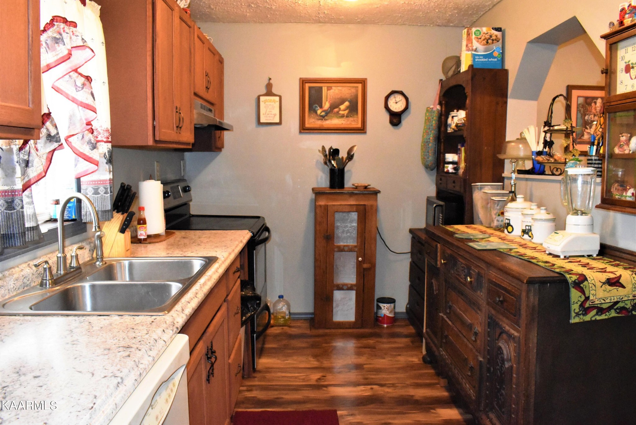 419 Stone Loop Crossville, TN 38571 - Photo 15 of 46 a kitchen with granite countertop a sink stove and cabinets