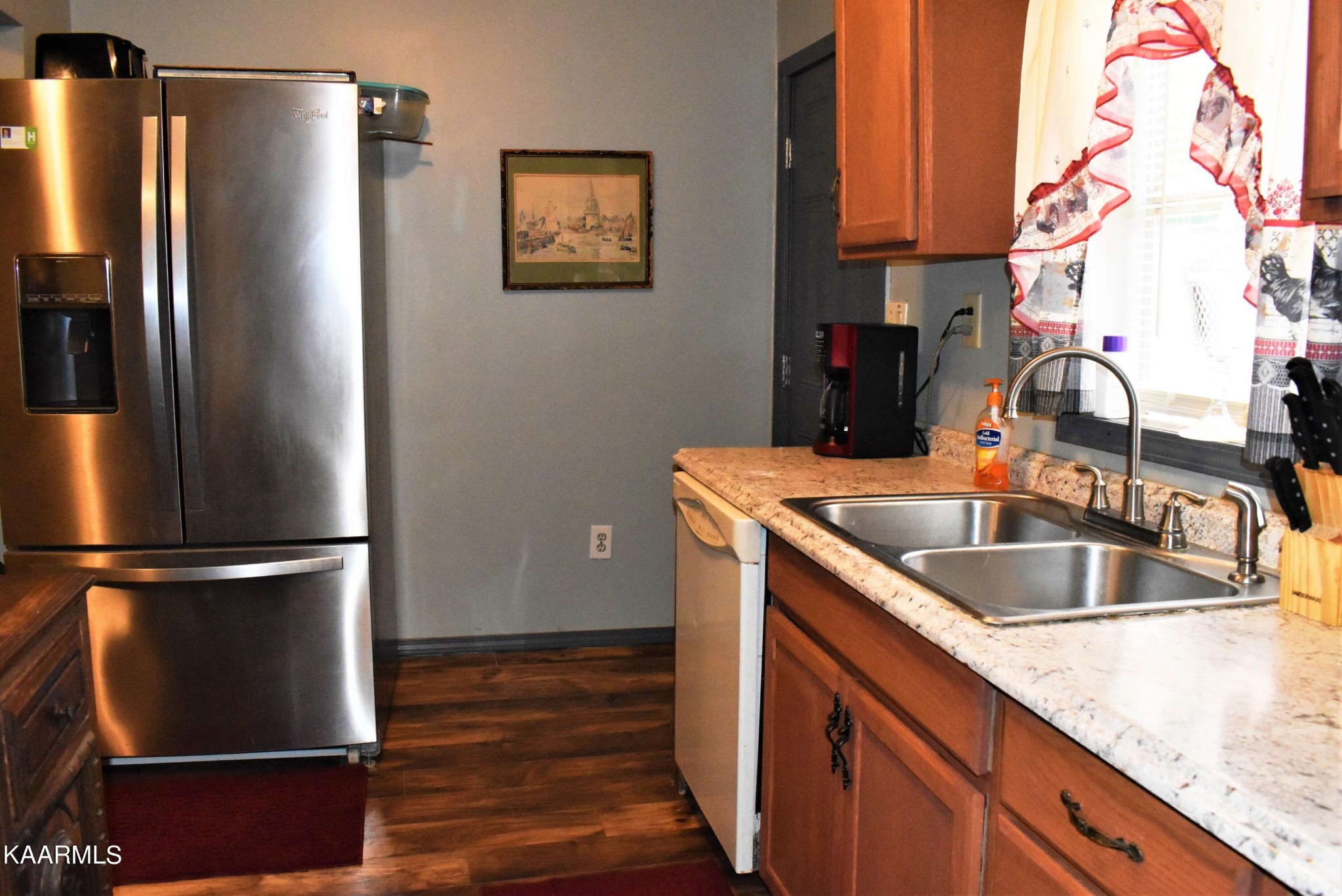 419 Stone Loop Crossville, TN 38571 - Photo 16 of 46 a kitchen with stainless steel appliances granite countertop a refrigerator and a sink