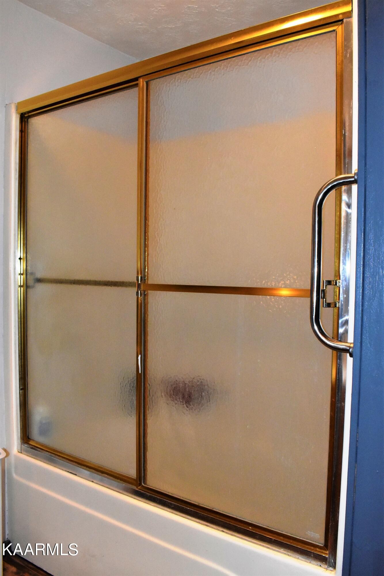 419 Stone Loop Crossville, TN 38571 - Photo 24 of 46 a bathroom with a glass shower door