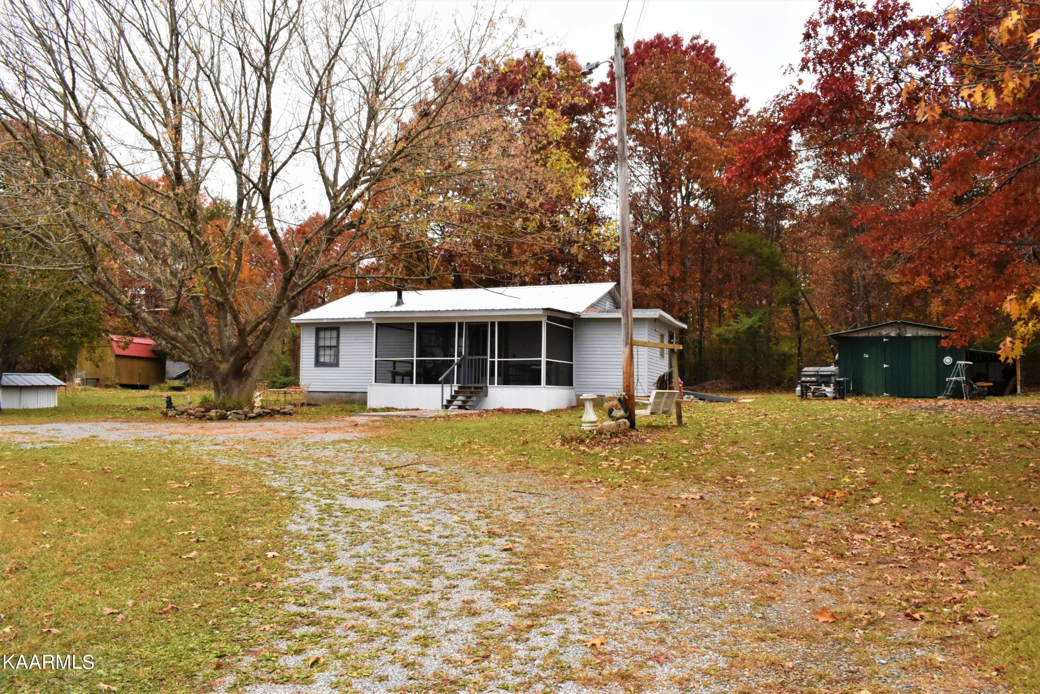 419 Stone Loop Crossville, TN 38571 - Photo 3 of 46 a front view of a house with a yard and trees