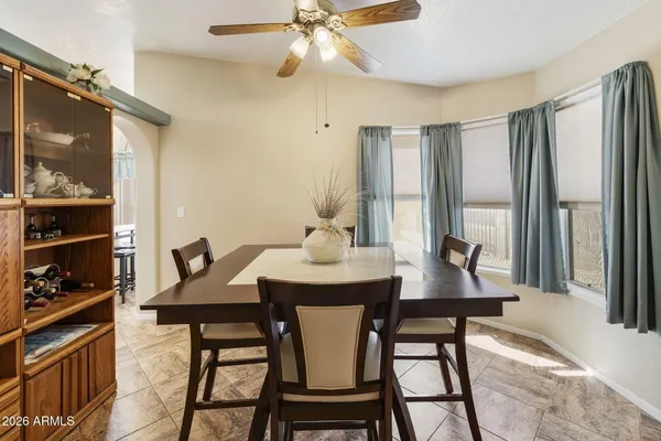 a view of a dining room with furniture and window