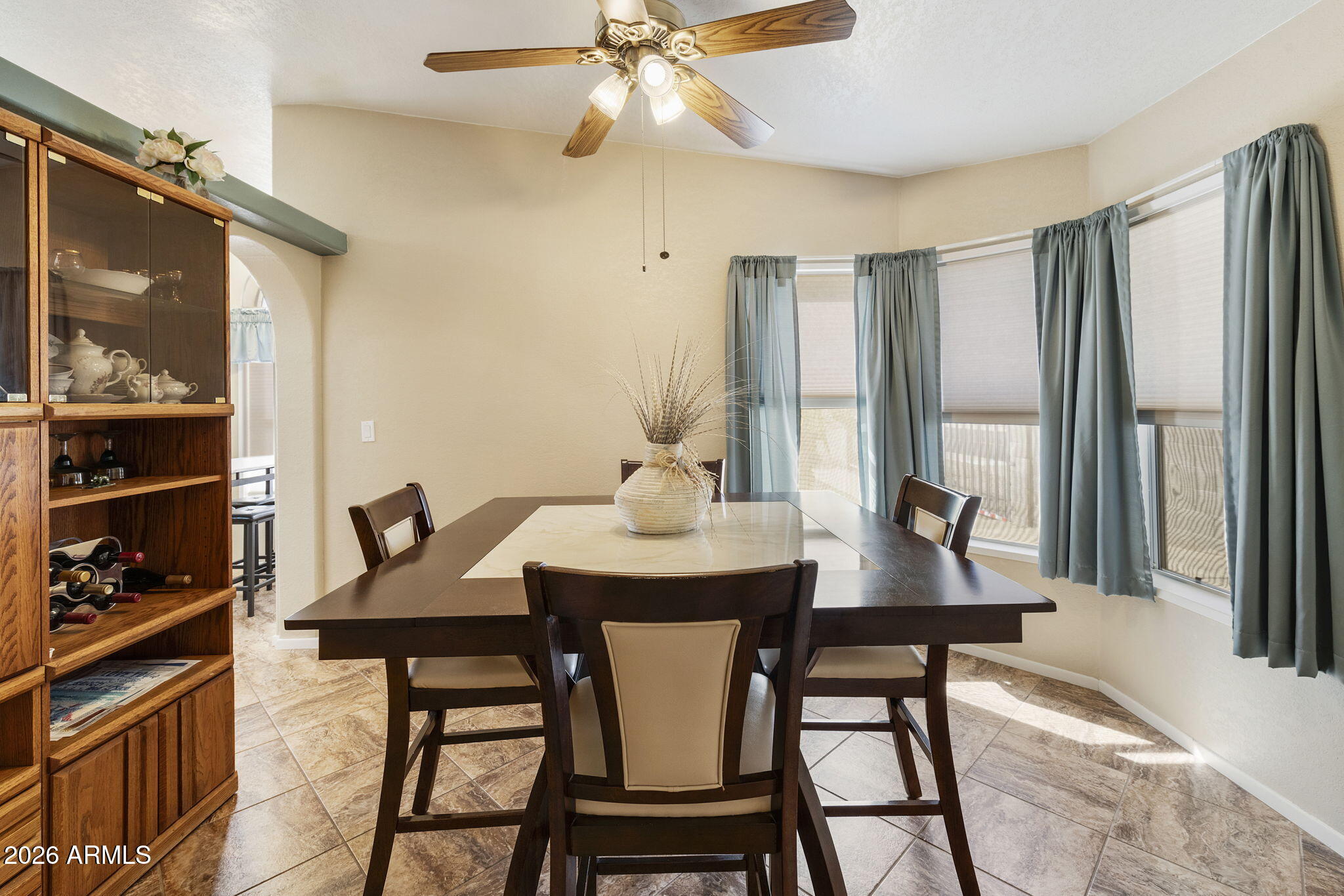 3700 South Tomahawk Road, Unit 23 Apache Junction, AZ 85119 - Photo 13 of 31 a view of a dining room with furniture and window