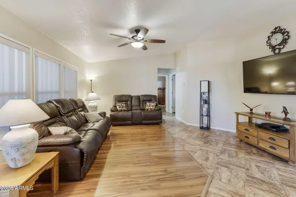 a living room with furniture and a flat screen tv