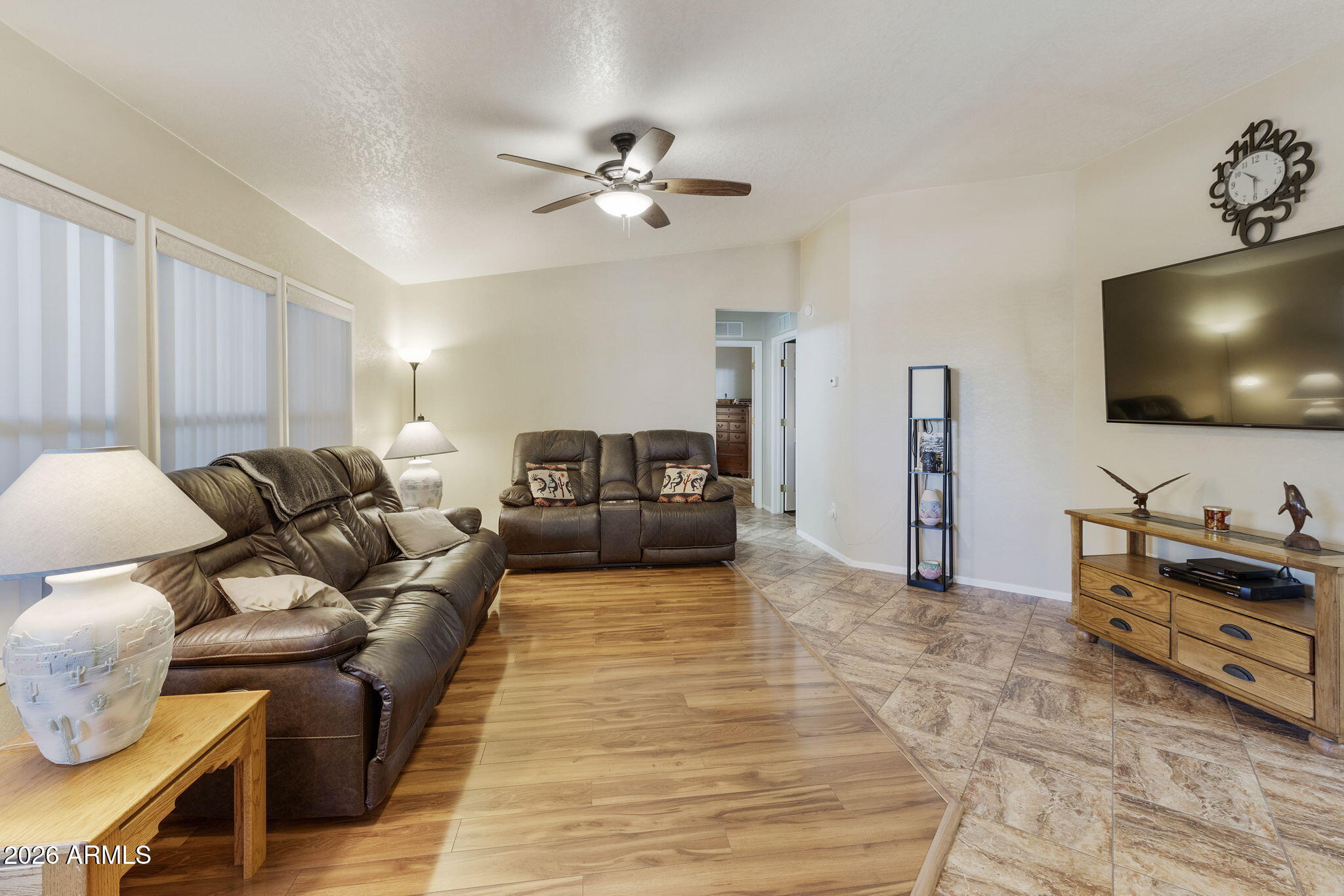 3700 South Tomahawk Road, Unit 23 Apache Junction, AZ 85119 - Photo 14 of 31 a living room with furniture and a flat screen tv