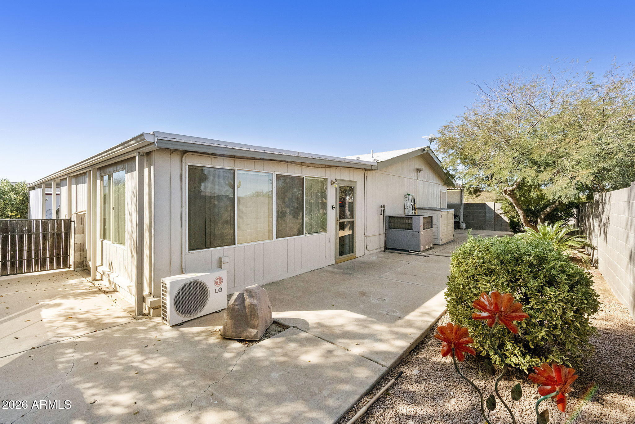 3700 South Tomahawk Road, Unit 23 Apache Junction, AZ 85119 - Photo 18 of 31 a view of a house with backyard and sitting area
