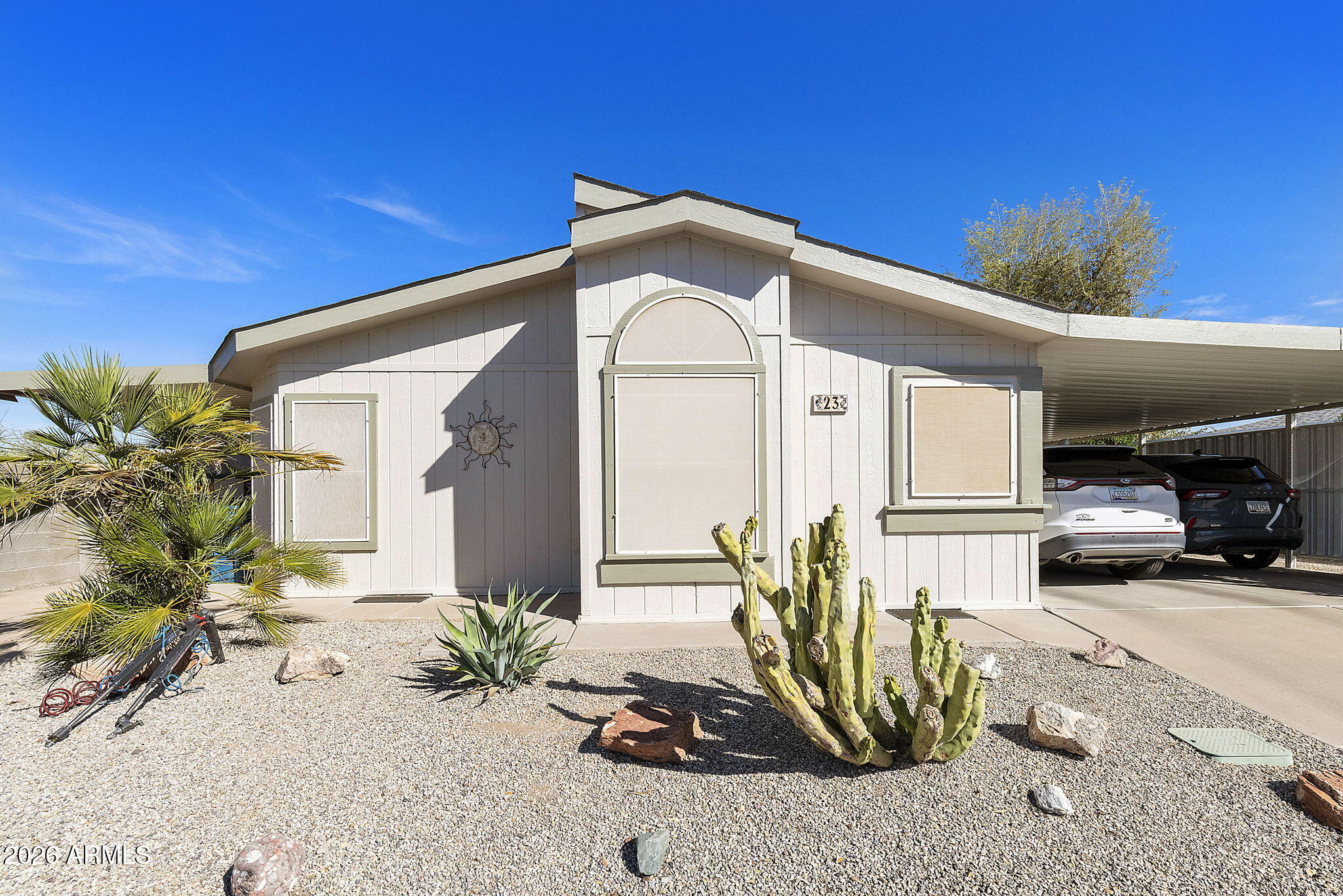 3700 South Tomahawk Road, Unit 23 Apache Junction, AZ 85119 - Photo 2 of 31 a view of a house with a patio
