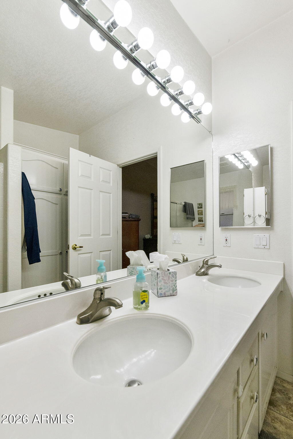 3700 South Tomahawk Road, Unit 23 Apache Junction, AZ 85119 - Photo 27 of 31 a bathroom with double vanity and a mirror
