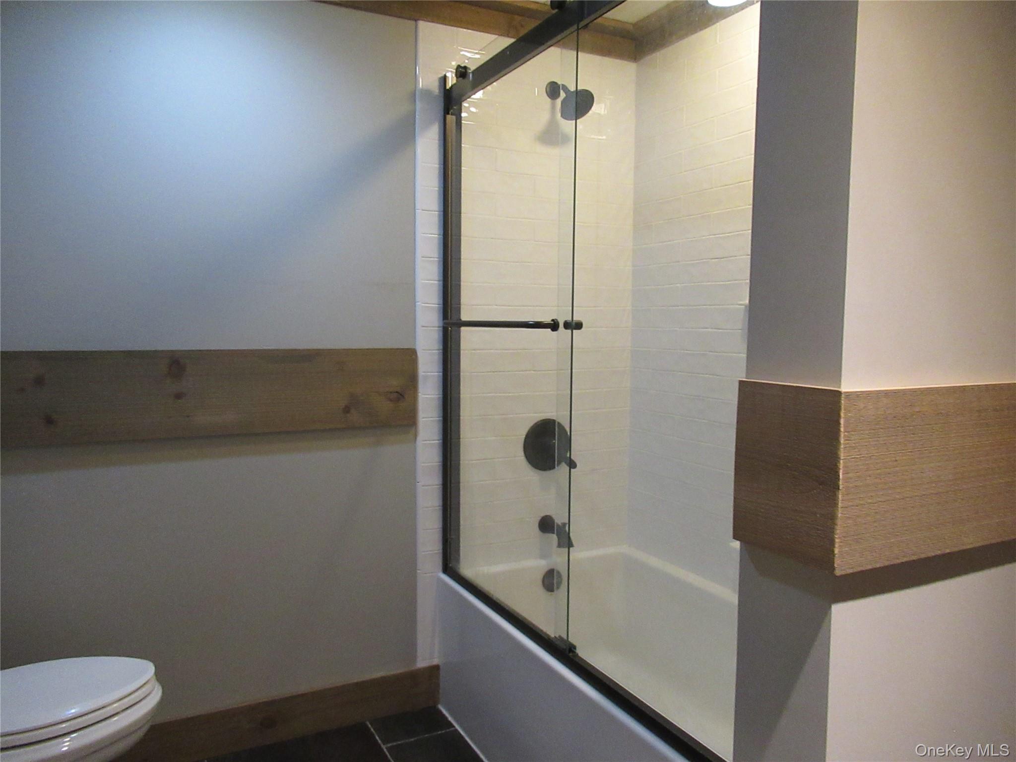 63 River Road, Unit B Pawling, NY 12564 - Photo 11 of 24 Newly renovated full bathtub and shower enclosure