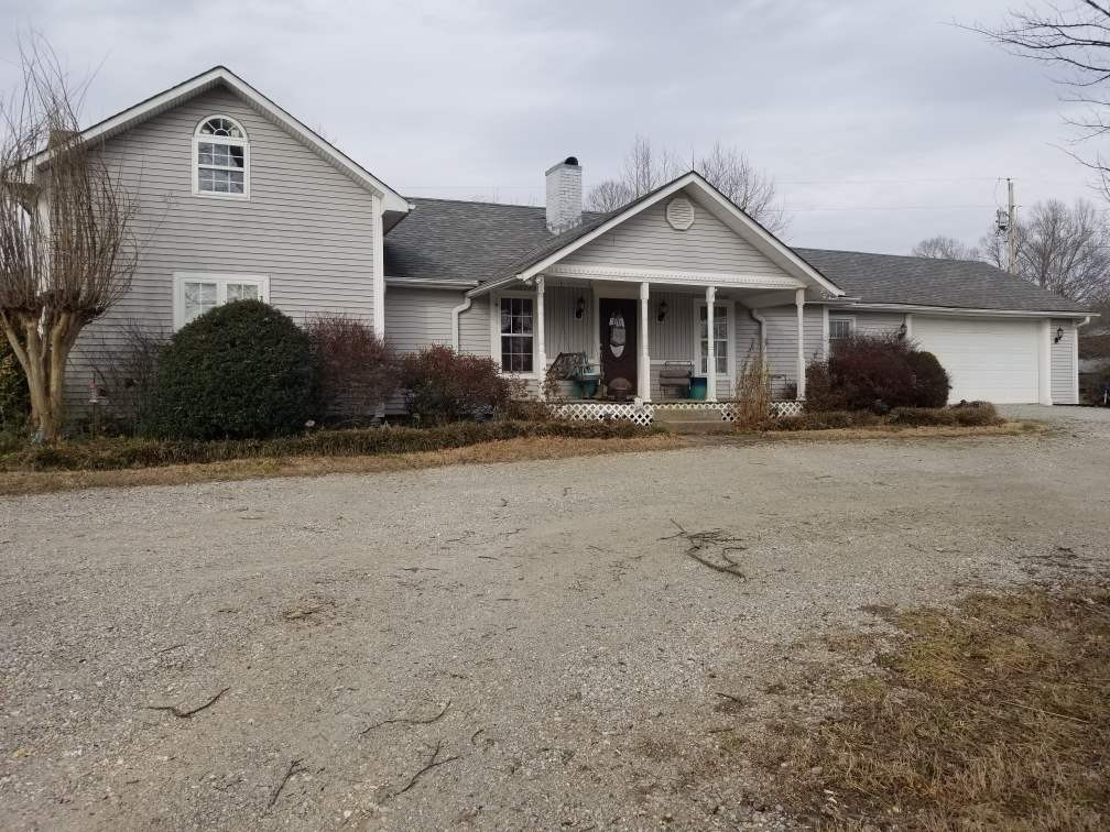 2790 Obrien Road Cedar Grove, TN 38321 - Photo 1 of 1 a front view of a house with a yard