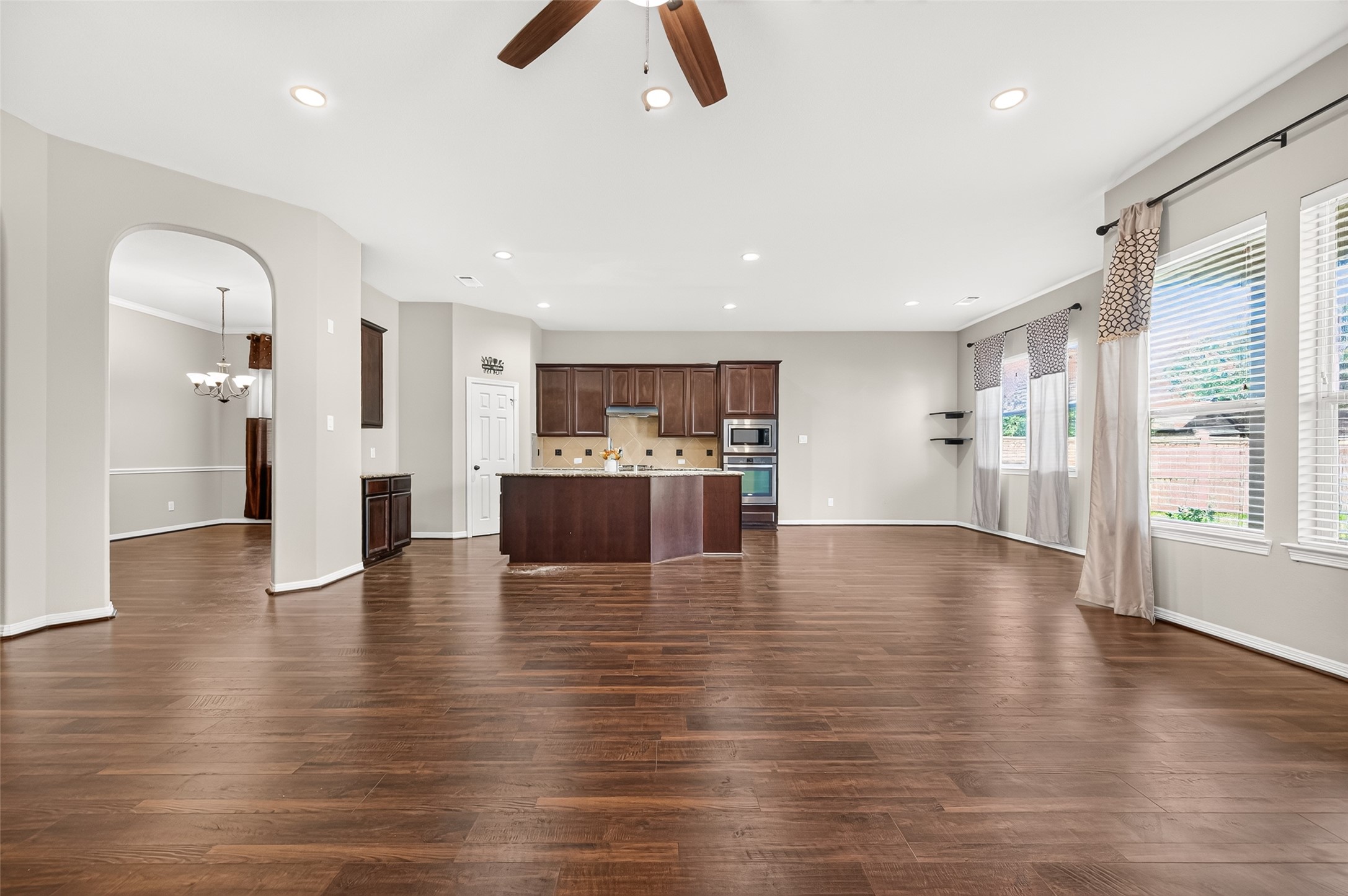 4314 Kent Ranch Court Katy, TX 77494 - Photo 17 of 49 Open-concept view across the living room to the kitchen and breakfast area.