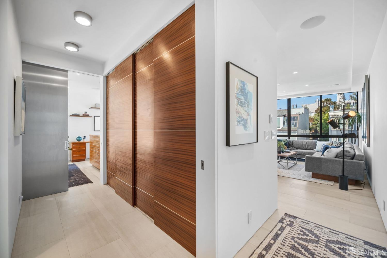455 Vallejo Street, Unit PH6 San Francisco, CA 94133 - Photo 11 of 45 a view of a hallway view with living room couch and a window
