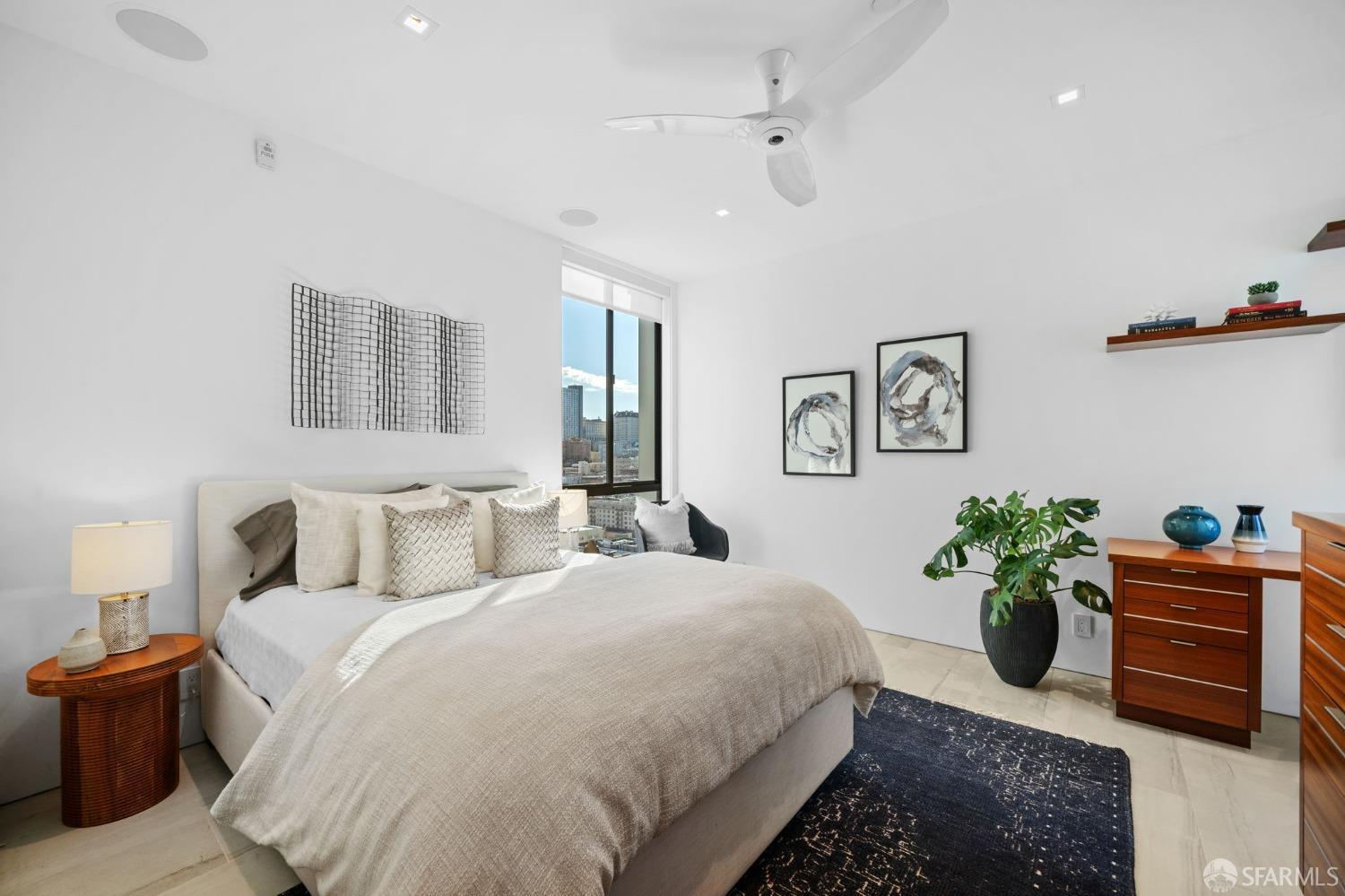 455 Vallejo Street, Unit PH6 San Francisco, CA 94133 - Photo 12 of 45 a bedroom with a bed and a potted plant