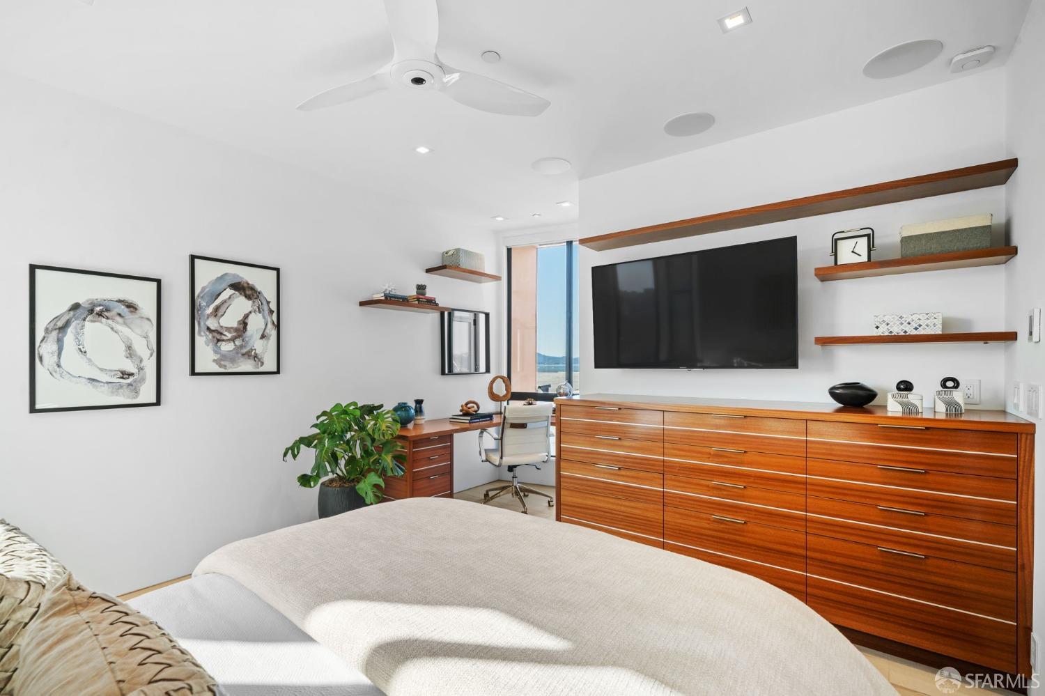 455 Vallejo Street, Unit PH6 San Francisco, CA 94133 - Photo 13 of 45 a living room with furniture and a flat screen tv