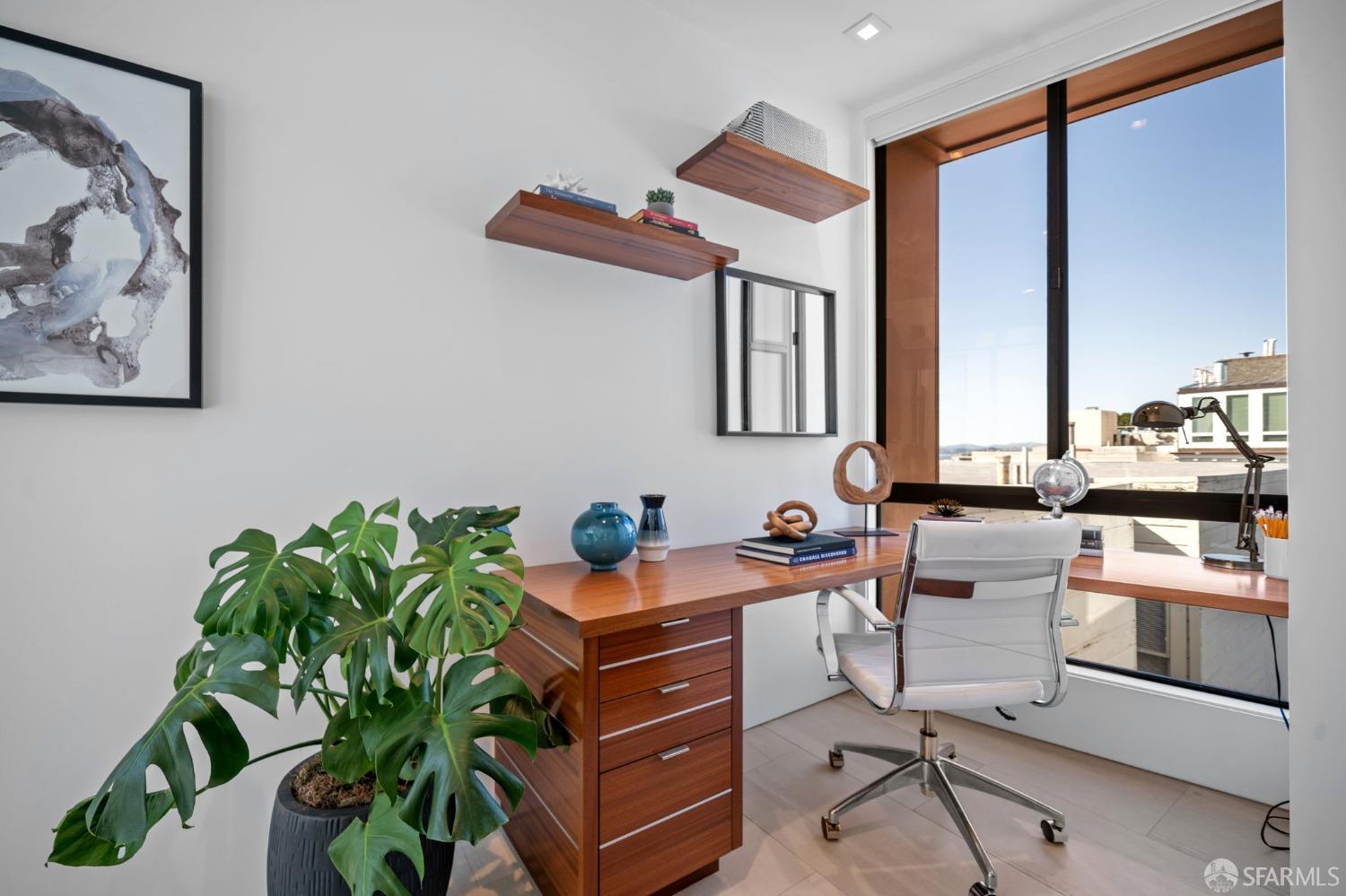 455 Vallejo Street, Unit PH6 San Francisco, CA 94133 - Photo 16 of 45 a kitchen with stainless steel appliances a white stove top oven and a potted plant