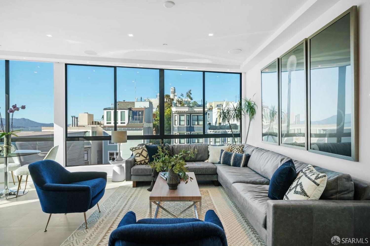 455 Vallejo Street, Unit PH6 San Francisco, CA 94133 - Photo 3 of 45 a living room with furniture and a large window