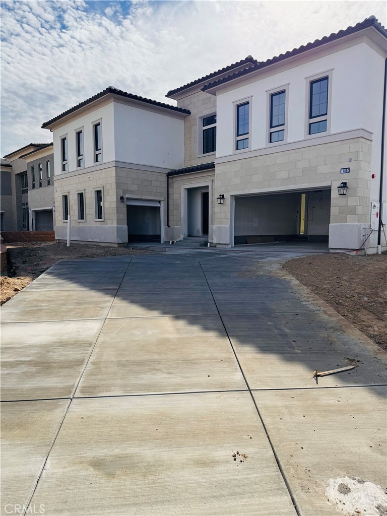 Front Elevation: Fernwood Italianate - The Ridge Collection at Bella Vista - Homesite 68 - Home is still under construction.