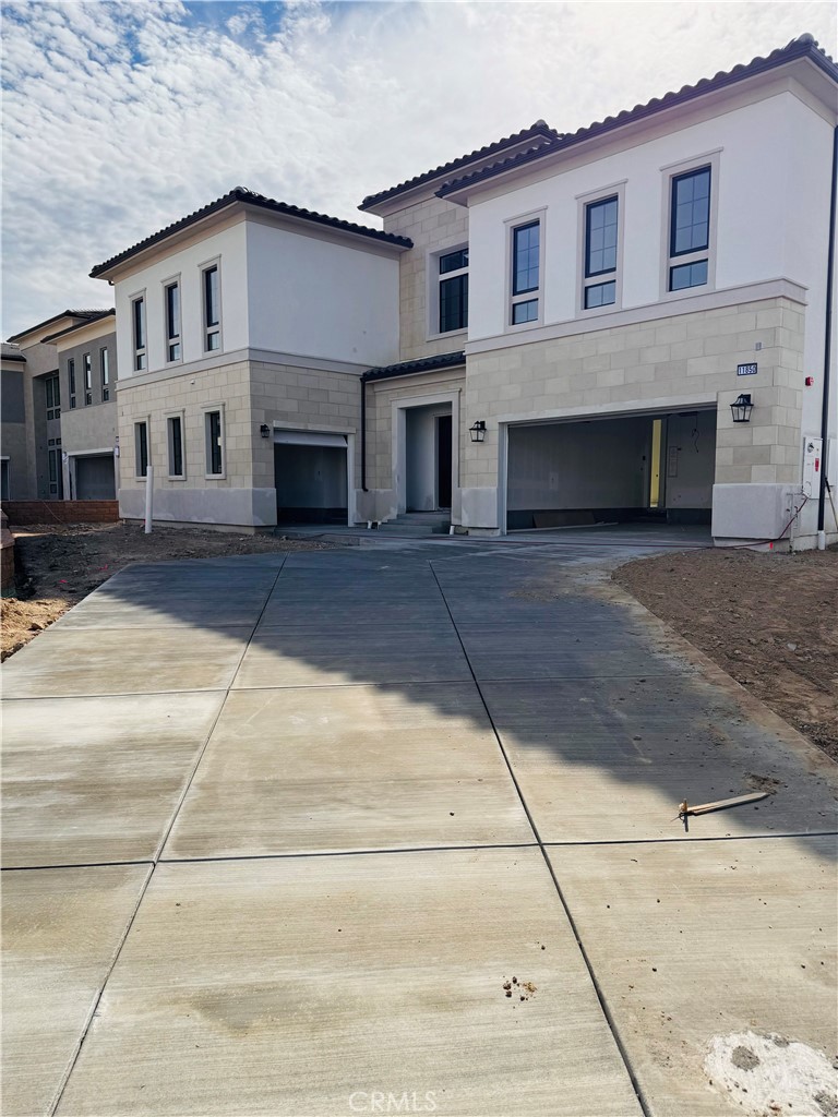 Front Elevation: Fernwood Italianate - The Ridge Collection at Bella Vista - Homesite 68 - Home is still under construction.